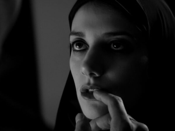 A GIRL WALKS HOME ALONE AT NIGHT