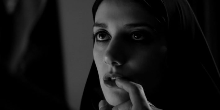 A GIRL WALKS HOME ALONE AT NIGHT