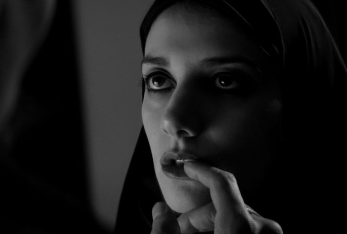 A GIRL WALKS HOME ALONE AT NIGHT